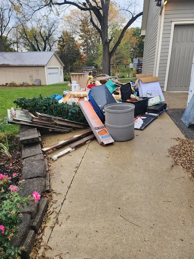 Dumpster being loaded with debris for Commercial Dumpster Rental in Marine City